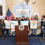 Food4All youth advocates lead legislators and the Food4All coalition in a chant at the state capitol